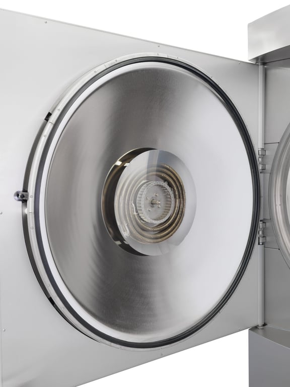 Open door of a Systec autoclave with integrated ultracooler (heat exchanger visible)